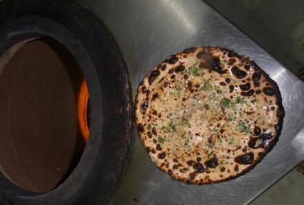 My first garlic Naan cooked in the Tandoor oven.