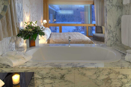 Bathroom with lake and mountain views
