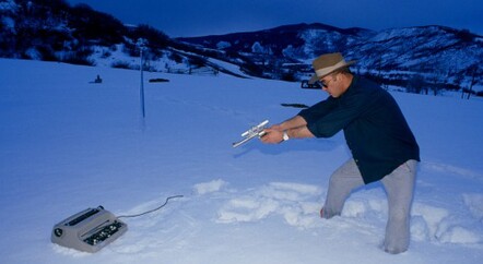 Hunter S Thompson shooting his typewriter