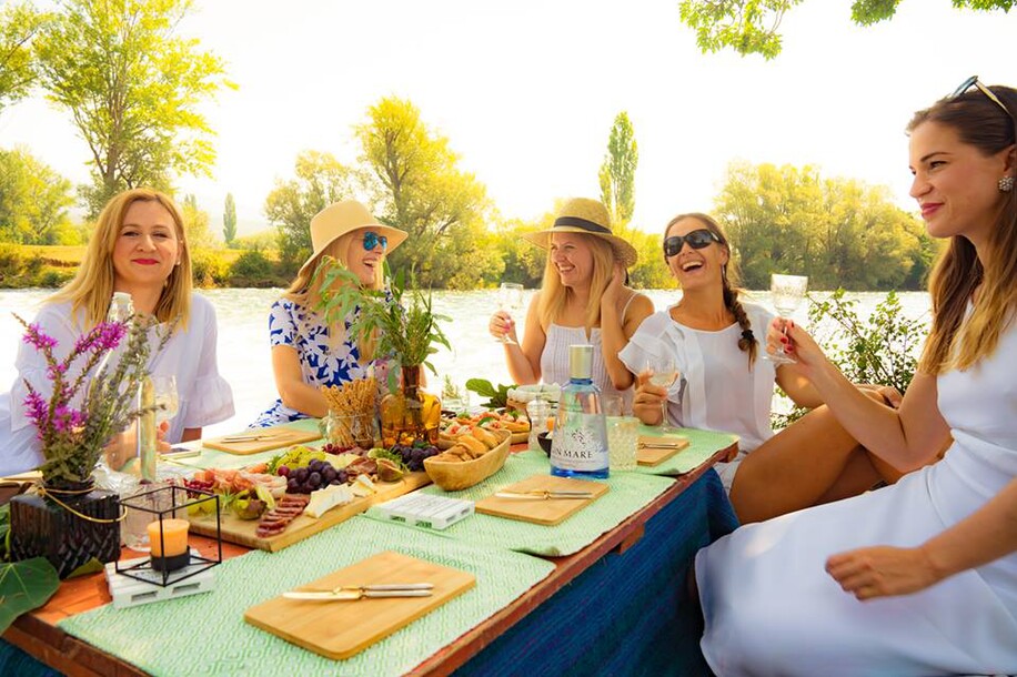 Katarina, Marina and Karmen with friends enjoying a riverside picnic in Glavice
