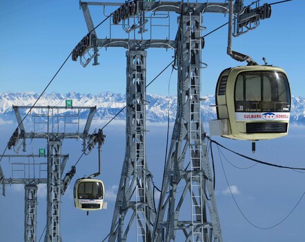 Chair lift above the clouds
